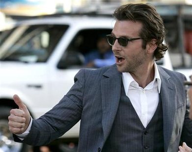 Cast member Bradley Cooper crosses the street after greeting fans at the Los Angeles premiere of "The Hangover" in Hollywood, June 2, 2009. REUTERS/Danny Moloshok
Cast member Bradley Cooper crosses the street after greeting fans at the Los Angeles premiere of "The Hangover" in Hollywood, June 2, 2009. REUTERS/Danny Moloshok