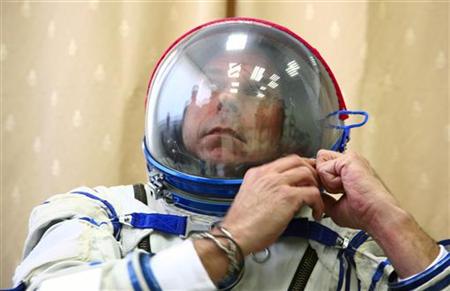 Guy Laliberte prepares for exercises during a training session in the International Space Station (ISS) at the Star City space centre outside Moscow, August 25, 2009. REUTERS/Sergei Remezov
Guy Laliberte prepares for exercises during a training session in the International Space Station (ISS) at the Star City space centre outside Moscow, August 25, 2009. REUTERS/Sergei Remezov