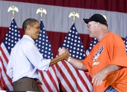 President Barack Obama (L) shakes hands with union member Charlie Dilbert as he attends an AFL-CIO Labor Day picnic at Coney Island in Cincinnati, September 7, 2009. REUTERS/Larry Downing
President Barack Obama (L) shakes hands with union member Charlie Dilbert as he attends an AFL-CIO Labor Day picnic at Coney Island in Cincinnati, September 7, 2009. REUTERS/Larry Downing