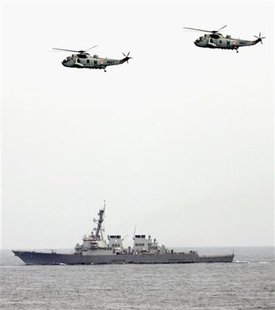 India's Sea Kings helicopters fly over USS. Higgins during the joint exercise between India and U.S. near the western Indian coastal state of Goa September 29, 2005. REUTERS/Punit Paranjpe
India's Sea Kings helicopters fly over USS. Higgins during the joint exercise between India and U.S. near the western Indian coastal state of Goa September 29, 2005. REUTERS/Punit Paranjpe