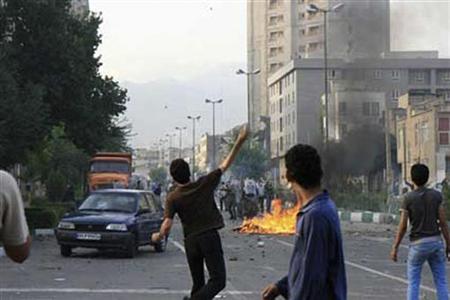 




Supporters of defeated Iranian presidential candidate Mirhossein Mousavi clash with riot policeman in Tehran June 20, 2009. REUTERS via Your View

