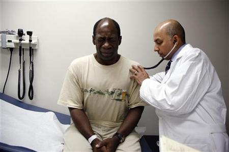 Ernest Sass, 52, (L) winces as he is attended to by Girish Bobby Kapur, M.D. (R) in a room used to see patients who don't require treatment for trauma inside the emergency room at Ben Taub General Hospital in Houston, Texas July 27, 2009. REUTERS/Jessica Rinaldi
Ernest Sass, 52, (L) winces as he is attended to by Girish Bobby Kapur, M.D. (R) in a room used to see patients who don't require treatment for trauma inside the emergency room at Ben Taub General Hospital in Houston, Texas July 27, 2009. REUTERS/Jessica Rinaldi