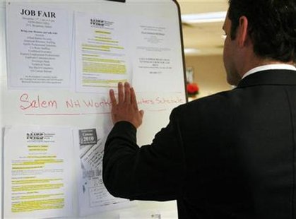 A man looks at job postings at a job fair in New Hampshire, December 17, 2008. REUTERS/Brian Snyder
A man looks at job postings at a job fair in New Hampshire, December 17, 2008. REUTERS/Brian Snyder