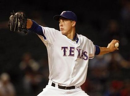 Texas Rangers starting pitcher Derek Holland pitches against the Seattle Mariners in the first inning of their MLB American League baseball game in Arlington, Texas September 13, 2009. REUTERS/Mike Stone
Texas Rangers starting pitcher Derek Holland pitches against the Seattle Mariners in the first inning of their MLB American League baseball game in Arlington, Texas September 13, 2009. REUTERS/Mike Stone