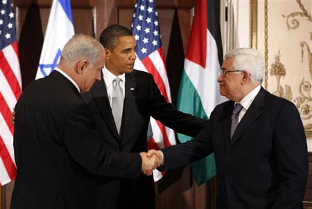 




Israeli Prime Minister Benjamin Netanyahu (L) shakes hands with Palestinian President Mahmoud Abbas in front of U.S. President Barack Obama (C) during a trilateral meeting at President Obama's hotel in New York September 22, 2009. REUTERS/Kevin Lamarque

