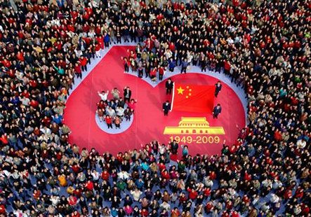 




People gather at a square to celebrate the upcoming 60th anniversary of the founding of the People's Republic of China during a photo call in Jilin, Jilin province on September 29, 2009. REUTERS/China Daily

