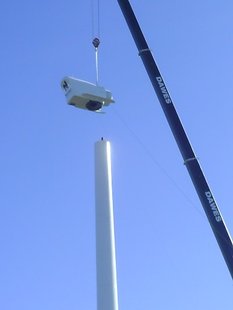 A crane installed the nacelee, or generator part, of a new 155-foot tall wind turbine at Wausau East High School. The Northwind turbine will produce 100 kilowatts of electricity or about 5 percent of the school's electricity. A second, smaller 15-kilowatt turbine will be installed in late October 2009. A crane installed the nacelee, or generator part, of a new 155-foot tall wind turbine at Wausau East High School. The Northwind turbine will produce 100 kilowatts of electricity or about 5 percent of the school's electricity. A second, smaller 15-kilowatt turbine will be installed in late October 2009.