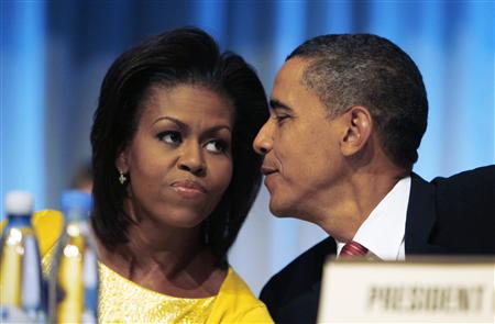 




U.S. President Barack Obama speaks to first lady Michelle Obama after arriving to make a presentation in Copenhagen October 2, 2009 in support of Chicago as the host city for the 2016 Summer Olympic Games. Chicago played its two trump cards on Friday, U.S. President Barack Obama and his wife Michelle both making impassioned speeches as they urged the International Olympic Committee (IOC) to choose the Windy City as host of the 2016 Olympics.