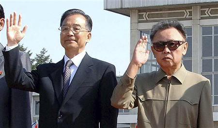 China's Premier Wen Jiabao (2nd L) waves beside North Korea's leader Kim Jong-il (2nd R) after his arrival in Pyongyang in this October 4, 2009, in this picture released by North Korea's official news agency KCNA. REUTERS/KCNA
China's Premier Wen Jiabao (2nd L) waves beside North Korea's leader Kim Jong-il (2nd R) after his arrival in Pyongyang in this October 4, 2009, in this picture released by North Korea's official news agency KCNA. REUTERS/KCNA