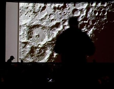 People watch a live video of the twin impacts of the Lunar Crater Observation and Sensing Satellite, or LCROSS, and its rocket's upper stage as they impact the moon at the NASA Ames Research Center in Moffett Field, California, October 9, 2009. REUTERS/Kim White
People watch a live video of the twin impacts of the Lunar Crater Observation and Sensing Satellite, or LCROSS, and its rocket's upper stage as they impact the moon at the NASA Ames Research Center in Moffett Field, California, October 9, 2009. REUTERS/Kim White