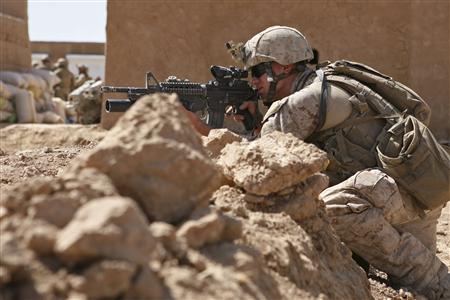 




Sgt. Zack Tharp, a reconnaissance Marine with Alpha Company, 2nd Reconnaissance Battalion, Marine Expeditionary Brigade-Afghanistan, provides cover while Marines in the background prepare to destroy confiscated drugs, at the Salaam Bazaar in Helmand province October 6, 2009. Picture taken October 6, 2009. REUTERS/U.S. Marine Corps/ Cpl. Aaron Rooks/Handout


