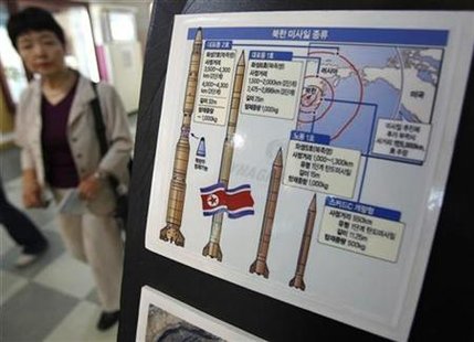 A tourist walks past a display showing North Korea's missile system at a South Korean observation post near the demilitarised zone separating the two Koreas in Paju, about 45 km (28 miles) north of Seoul, September 4, 2009. REUTERS/Jo Yong-Hak
A tourist walks past a display showing North Korea's missile system at a South Korean observation post near the demilitarised zone separating the two Koreas in Paju, about 45 km (28 miles) north of Seoul, September 4, 2009. REUTERS/Jo Yong-Hak