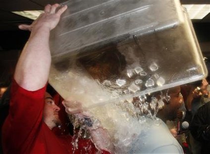 Philadelphia Phillies Ryan Howard has ice dumped on him while celebrating the Phillies win over the Colorado Rockies in their MLB National League Division Series playoff baseball game in Denver, October 12, 2009. REUTERS/Rick Wilking
Philadelphia Phillies Ryan Howard has ice dumped on him while celebrating the Phillies win over the Colorado Rockies in their MLB National League Division Series playoff baseball game in Denver, October 12, 2009. REUTERS/Rick Wilking