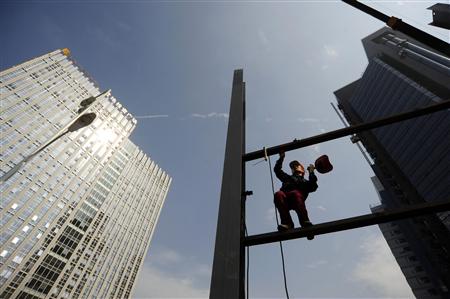 A worker melts a structure of a billboard at a construction site in Hefei, Anhui province October 14, 2009. China's economic growth will easily reach its 8 percent target this year and will increase to 9 percent in 2010 as it leads major countries in the rebound from the global downturn, a Reuters poll shows. REUTERS/Stringer
A worker melts a structure of a billboard at a construction site in Hefei, Anhui province October 14, 2009. China's economic growth will easily reach its 8 percent target this year and will increase to 9 percent in 2010 as it leads major countries in the rebound from the global downturn, a Reuters poll shows. REUTERS/Stringer