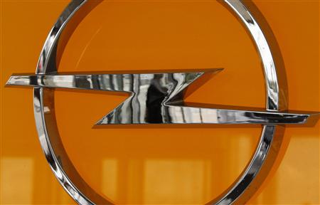 




A woman is reflected in the logo of an Opel car as she arrives at the Opel assembly plant in Antwerp September 14, 2009. REUTERS/Francois Lenoir

