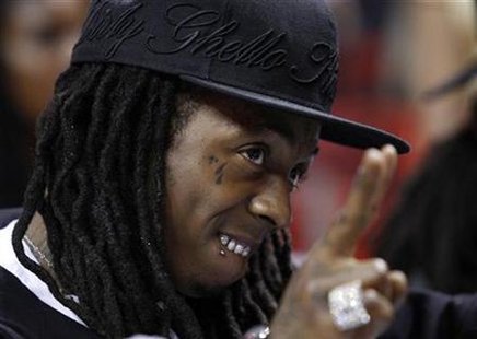 Rap recording artist Lil Wayne watches the Miami Heat play the Atlanta Hawks in Game 4 of their NBA Eastern Conference playoff series in Miami, Florida April 27, 2009. REUTERS/Hans Deryk
Rap recording artist Lil Wayne watches the Miami Heat play the Atlanta Hawks in Game 4 of their NBA Eastern Conference playoff series in Miami, Florida April 27, 2009. REUTERS/Hans Deryk
