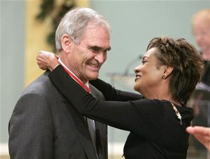 




John "Jack" Poole (L), chair of the Vancouver 2010 Olympic Winter Games organizing committee, is awarded the rank of Officer in the Order of Canada by Governor General Michaelle Jean at Rideau Hall in Ottawa December 15, 2006. REUTERS/Chris Wattie

