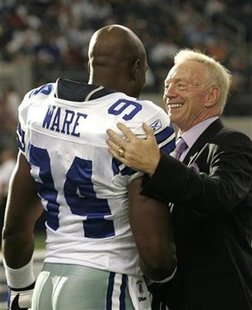 Dallas Cowboys team owner Jerry Jones (R) talks with Cowboys linebacker DeMarcus Ware (L) before the start of preseason NFL football action against the Tennessee Titans at the new Cowboys Stadium in Arlington, Texas August 21, 2009. REUTERS/Jessica Rinaldi
Dallas Cowboys team owner Jerry Jones (R) talks with Cowboys linebacker DeMarcus Ware (L) before the start of preseason NFL football action against the Tennessee Titans at the new Cowboys Stadium in Arlington, Texas August 21, 2009. REUTERS/Jessica Rinaldi