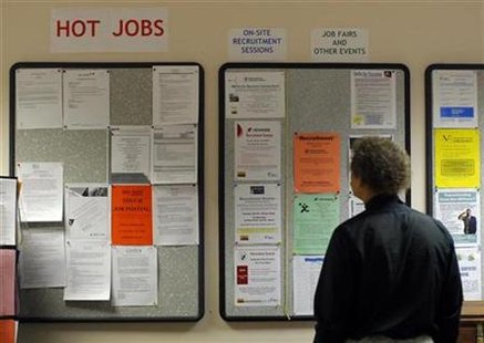 Librarian Gary Klein looks at the jobs and other announcements posted at The Work Place, which provides comprehensive employment and career services, in Boston, Massachusetts July 2, 2009. REUTERS/Brian Snyder
Librarian Gary Klein looks at the jobs and other announcements posted at The Work Place, which provides comprehensive employment and career services, in Boston, Massachusetts July 2, 2009. REUTERS/Brian Snyder