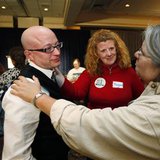 Gay marriage supporters Barb Wood (R) and Margaret O'Connell (C), comfort Tim Diehl as they wait for election results at the No on 1/Protect Maine Equality election night rally in Portland, Maine November 4, 2009. The group is working to prevent the repeal of Maine's gay marriage law, which was adopted last spring by Maine's legislature. REUTERS/Joel Page
Gay marriage supporters Barb Wood (R) and Margaret O'Connell (C), comfort Tim Diehl as they wait for election results at the No on 1/Protect Maine Equality election night rally in Portland, Maine November 4, 2009. The group is working to prevent the repeal of Maine's gay marriage law, which was adopted last spring by Maine's legislature. REUTERS/Joel Page