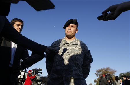 Military Police Sgt. Andrew Hagerman, who was a first responder to the shooting at Fort Hood Army Post talks with reporters at Fort Hood Army Post in Fort Hood, Texas November 6, 2009. The death toll from an Army psychiatrist who opened fire at the Fort Hood Army post rose to 13 on Friday, and Army officials said the suspected shooter was hospitalized and on a ventilator. REUTERS/Jessica Rinaldi
Military Police Sgt. Andrew Hagerman, who was a first responder to the shooting at Fort Hood Army Post talks with reporters at Fort Hood Army Post in Fort Hood, Texas November 6, 2009. The death toll from an Army psychiatrist who opened fire at the Fort Hood Army post rose to 13 on Friday, and Army officials said the suspected shooter was hospitalized and on a ventilator. REUTERS/Jessica Rinaldi