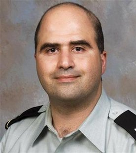 Major Nidal Malik Hasan, the U.S. Army doctor identified by authorities as the suspect in a mass shooting at the U.S. Army post in Fort Hood, Texas, is seen in this undated handout photo from a pdf file of the U.S. Government Uniformed Services University of the Health Sciences downloaded on November 6, 2009. Investigators searched for the motive on Friday behind the mass shooting at a sprawling U.S. Army base in Texas, in which the Army psychia
Major Nidal Malik Hasan, the U.S. Army doctor identified by authorities as the suspect in a mass shooting at the U.S. Army post in Fort Hood, Texas, is seen in this undated handout photo from a pdf file of the U.S. Government Uniformed Services University of the Health Sciences downloaded on November 6, 2009. Investigators searched for the motive on Friday behind the mass shooting at a sprawling U.S. Army base in Texas, in which the Army psychia