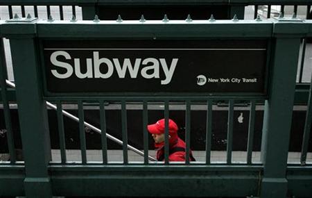 
A rider emerges from the Union Square subway station in New York, December 15, 2005. REUTERS/Jeff Zelevansky/Files
