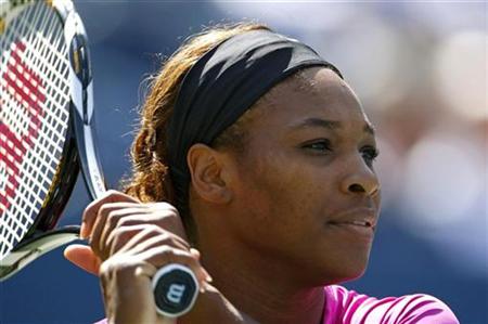 
Serena Williams of the U.S. follows through on a shot during the women's doubles final match with her sister Venus against Cara Black of Zimbabwe and Liezel Huber of the U.S. at the U.S. Open tennis tournament in New York September 14, 2009. REUTERS/Shaun Best
