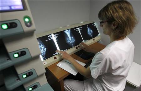 
A radiologist examines breast X-rays after a cancer prevention medical check-up at the Ambroise Pare hospital in Marseille, southern France, on April 3, 2008. REUTERS/Jean-Paul Pelissier
