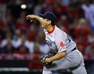 
Relief pitcher Takashi Saito delivers against the Los Angeles Angels during seventh inning during of Game 1 of their American League Division Series playoff baseball game in Anaheim, California in this October 8, 2009 file photo. REUTERS/Mike Blake
