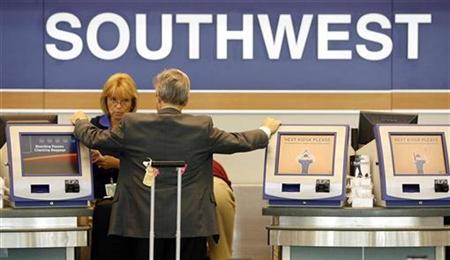 A passenger waits at the Southwest Airlines ticket counter at Midway Airport in Chicago, July 24, 2008. REUTERS/Jeff Haynes
A passenger waits at the Southwest Airlines ticket counter at Midway Airport in Chicago, July 24, 2008. REUTERS/Jeff Haynes
