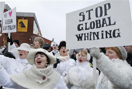 
Protestors hold signboards during a demonstration in Copenhagen December 16, 2009. Copenhagen is the host city for the United Nations Climate Change Conference 2009, which lasts from December 7 until December 18. REUTERS/Pawel Kopczynski
