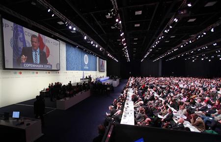 
Denmark's Prime Minister Lars Lokke Rasmussen is seen on a video screen as he delivers the opening speech of the high-level segment of the UN Climate Change Conference 2009 in Copenhagen December 15, 2009. REUTERS/Bob Strong
