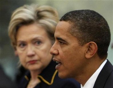 
U.S. President Barack Obama and Secretary of State Hillary Clinton attend a bilateral meeting with Chinese President Hu Jintao at the Great Hall of the People in Beijing, November 17, 2009. REUTERS/Jim Young
