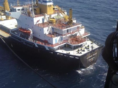A member of Venezuela's Maritime Rescue and Aid service looks out of a MI 17 helicopter during the rescue mission of the crew of the Greek bulk carrier "Aegean Wind" at 33 nautical miles (61 km) northeast of the Venezuelan Caribbean island of La Blanquilla December 25, 2009. REUTERS/Venezuela Maritime Rescue and Aid service/Handout
A member of Venezuela's Maritime Rescue and Aid service looks out of a MI 17 helicopter during the rescue mission of the crew of the Greek bulk carrier "Aegean Wind" at 33 nautical miles (61 km) northeast of the Venezuelan Caribbean island of La Blanquilla December 25, 2009. REUTERS/Venezuela Maritime Rescue and Aid service/Handout