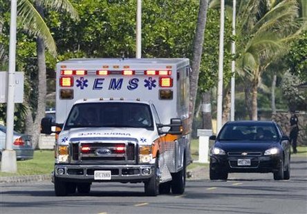 
An ambulance followed by a car drives away from the house on the street where U.S. President Barack Obama is staying on vacation in Kailua, Hawaii, December 28, 2009. REUTERS/Larry Downing
