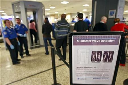 A sign explains the procedure for going through the whole body scan machine, or millimeter wave machine as passengers wait in line at a security check point at the Salt Lake International Airport in Salt Lake City, Utah, March 10, 2009. REUTERS/George Frey
A sign explains the procedure for going through the whole body scan machine, or millimeter wave machine as passengers wait in line at a security check point at the Salt Lake International Airport in Salt Lake City, Utah, March 10, 2009. REUTERS/George Frey