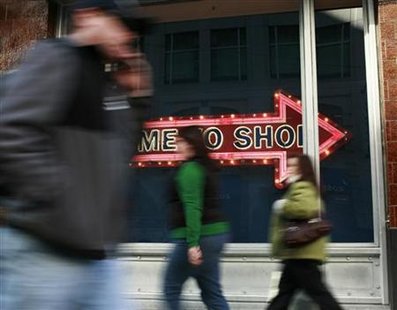 People walk past a sign during the holiday shopping season in San Francisco, California December 23, 2009. REUTERS/Robert Galbraith
People walk past a sign during the holiday shopping season in San Francisco, California December 23, 2009. REUTERS/Robert Galbraith