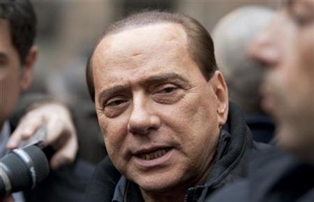 Italy's Prime Minister Silvio Berlusconi talks to reporters as he arrives in his private residence at Grazioli palace in Rome January 11, 2010. REUTERS/Max Rossi
Italy's Prime Minister Silvio Berlusconi talks to reporters as he arrives in his private residence at Grazioli palace in Rome January 11, 2010. REUTERS/Max Rossi