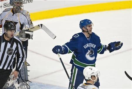 Vancouver Canucks Alex Burrows (R) reacts after he was given a penalty for interference by referee Stephane Auger during the third period of their NHL hockey game against the Nashville Predators in Vancouver, British Columbia, January 11, 2010. REUTERS/Andy Clark
Vancouver Canucks Alex Burrows (R) reacts after he was given a penalty for interference by referee Stephane Auger during the third period of their NHL hockey game against the Nashville Predators in Vancouver, British Columbia, January 11, 2010. REUTERS/Andy Clark