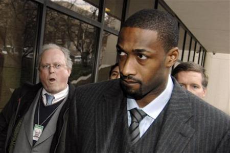 Washington Wizards guard Gilbert Arenas, currently serving an indefinite suspension from the NBA, is trailed by reporters as he arrives to face felony gun charges at the District of Columbia Superior Courthouse in Washington, January 15, 2010. REUTERS/Jonathan Ernst
Washington Wizards guard Gilbert Arenas, currently serving an indefinite suspension from the NBA, is trailed by reporters as he arrives to face felony gun charges at the District of Columbia Superior Courthouse in Washington, January 15, 2010. REUTERS/Jonathan Ernst