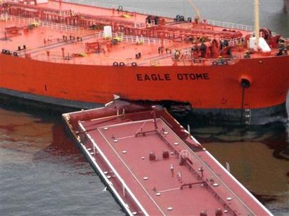
The Eagle Otome and another barge are seen after they collided in Port Arthur, Texas, in this handout photograph taken and released on January 23, 2010. REUTERS/U.S. Coast Guard/Handout
