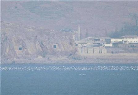 Two caves with coastal artillery (L) are seen at the North Korean village of Haeju where North Korea's military units are stationed in this March 10, 2009 file photo taken from South Korea's Yeonpyeong Island near the western maritime border between the two Koreas, 11 km (7 miles) from North Korea, about 115 km (71 miles) northwest of Seoul and the scene of deadly skirmishes between the two Korean navies in the past. North and South Korea on Jan
Two caves with coastal artillery (L) are seen at the North Korean village of Haeju where North Korea's military units are stationed in this March 10, 2009 file photo taken from South Korea's Yeonpyeong Island near the western maritime border between the two Koreas, 11 km (7 miles) from North Korea, about 115 km (71 miles) northwest of Seoul and the scene of deadly skirmishes between the two Korean navies in the past. North and South Korea on Jan