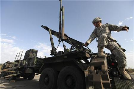 
A U.S Army officer stands on a launcher for a Patriot missile interceptor during a joint Israeli-U.S. air-defence exercise dubbed 'Juniper Cobra', in Tel Aviv October 27, 2009. REUTERS/Ziv Koren/Pool

