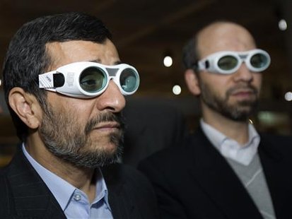 Iran's President Mahmoud Ahmadinejad (L) and Industries Minister Ali Akbar Mehrabian wear protective glasses while visiting an exhibition of Iran laser science and technology in Tehran February 7, 2010. REUTERS/Raheb Homavandi
Iran's President Mahmoud Ahmadinejad (L) and Industries Minister Ali Akbar Mehrabian wear protective glasses while visiting an exhibition of Iran laser science and technology in Tehran February 7, 2010. REUTERS/Raheb Homavandi