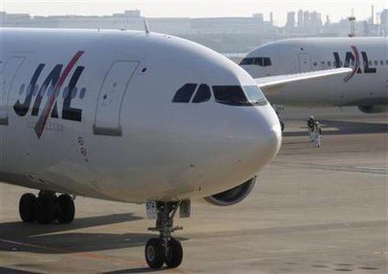 
Japan Airlines airplanes are parked at Haneda international airport in Tokyo January 19, 2010. REUTERS/Issei Kato
