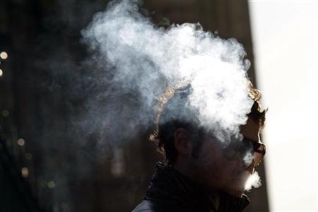 A man smokes in central London February 1, 2010. REUTERS/Stefan Wermuth
A man smokes in central London February 1, 2010. REUTERS/Stefan Wermuth