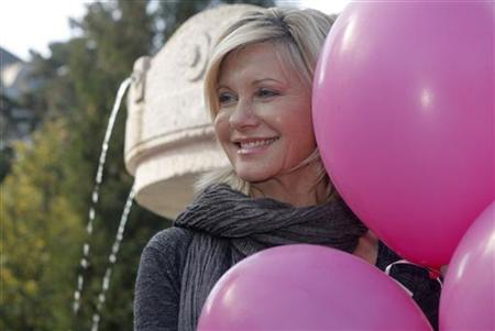 Australian singer and actress Olivia Newton-John poses to promote the "Pink Ribbon" breast cancer campaign in Vienna October 5, 2009. REUTERS/Heinz-Peter Bader
Australian singer and actress Olivia Newton-John poses to promote the "Pink Ribbon" breast cancer campaign in Vienna October 5, 2009. REUTERS/Heinz-Peter Bader
