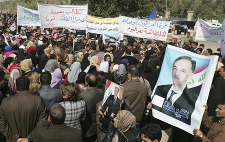 Demonstrators take part in a rally demanding that Iraqi Sunni lawmakers Saleh al-Mutlaq and Dhafer al-Ani be allowed to run in the March 7 parliamentarian election, in Baghdad, February 13, 2010. REUTERS/Saad Shalash
Demonstrators take part in a rally demanding that Iraqi Sunni lawmakers Saleh al-Mutlaq and Dhafer al-Ani be allowed to run in the March 7 parliamentarian election, in Baghdad, February 13, 2010. REUTERS/Saad Shalash