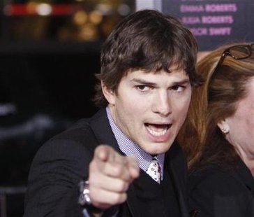 Cast member Ashton Kutcher gestures at the premiere of "Valentine's Day" at the Grauman's Chinese theatre in Hollywood, California February 8, 2010. REUTERS/Mario Anzuoni
Cast member Ashton Kutcher gestures at the premiere of "Valentine's Day" at the Grauman's Chinese theatre in Hollywood, California February 8, 2010. REUTERS/Mario Anzuoni
